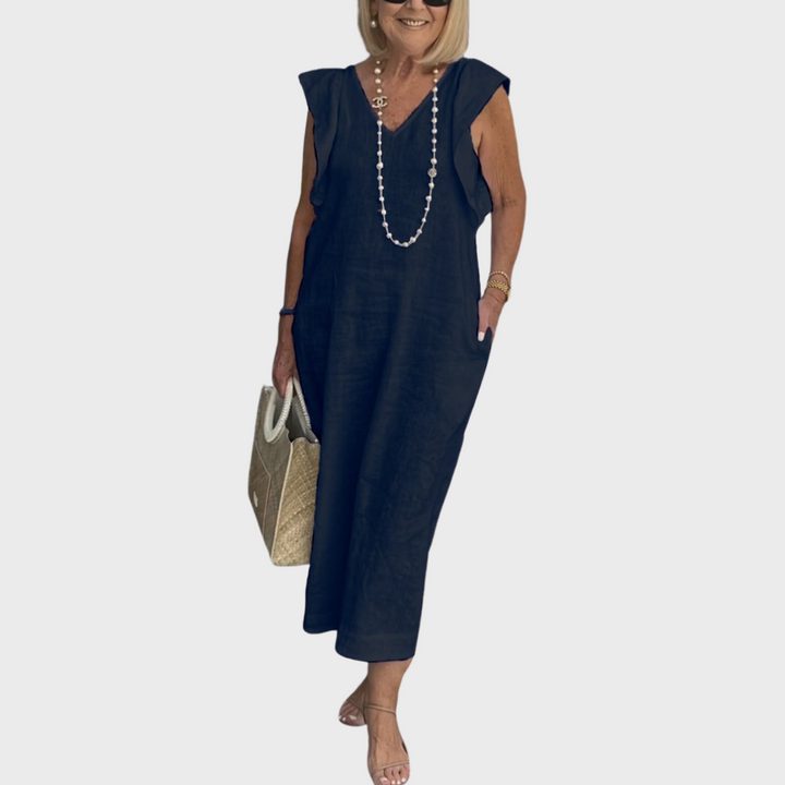 Elegant V-neck maxi dress for women with stylish ruffle shoulders and essential hidden pockets, versatile style.