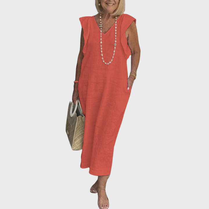 Elegant women's sleeveless V-neck maxi dress, featuring ruffle shoulders & handy pockets, for chic style.