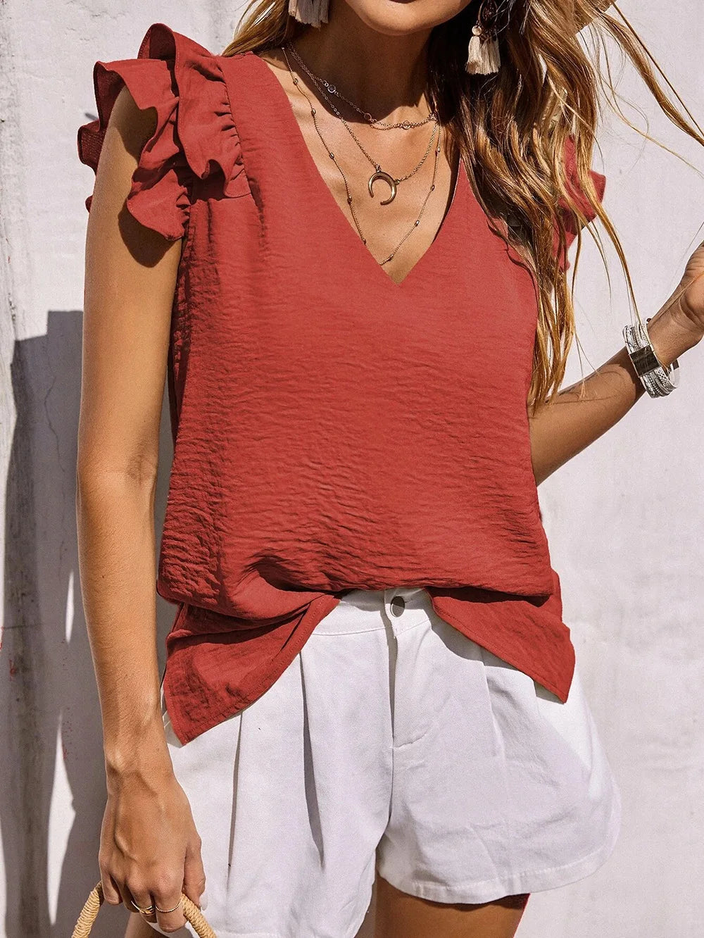 Stylish women's ruffle sleeve summer top featuring a flattering V-neck, ideal for warm weather.