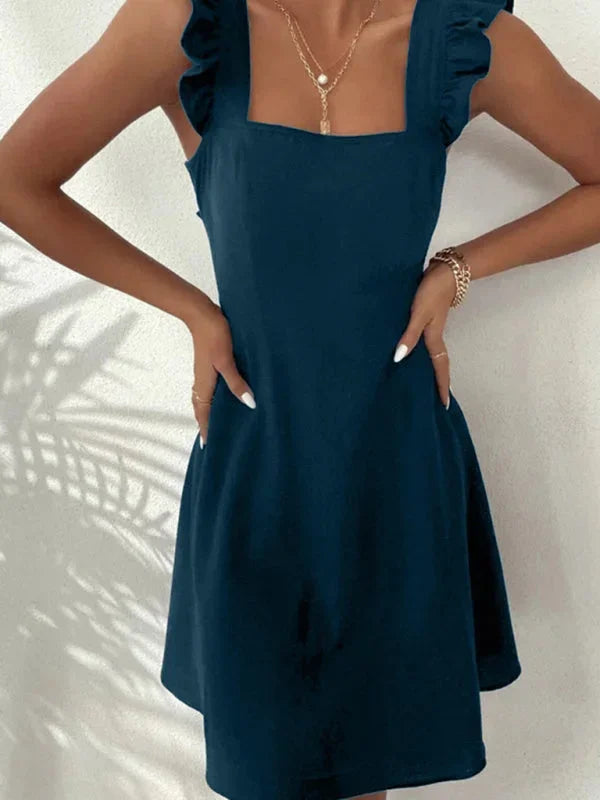 Party-ready women's short dress, square neck, ruffle straps, and a charming bow.