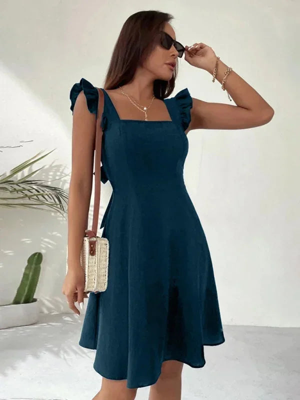 Versatile women's mini dress: Ruffle strap A-line with an adorable bow back.
