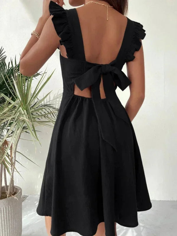 Casual women's short dress, A-line, ruffle straps, and a cute bow back.