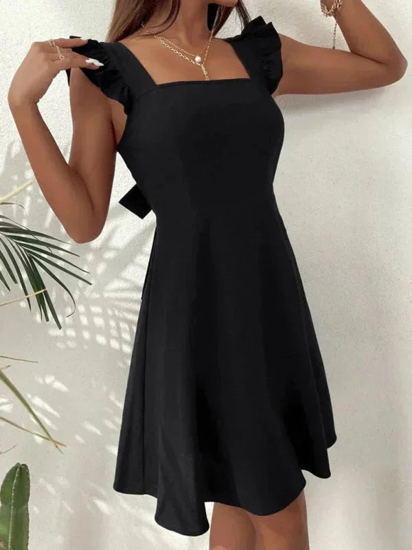 Flirty summer A-line mini dress, women's, with ruffle straps and bow back.