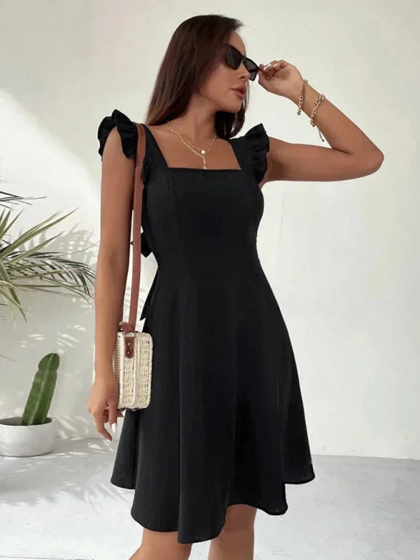 Women's party mini dress, A-line, ruffle straps, square neck and bow detail.