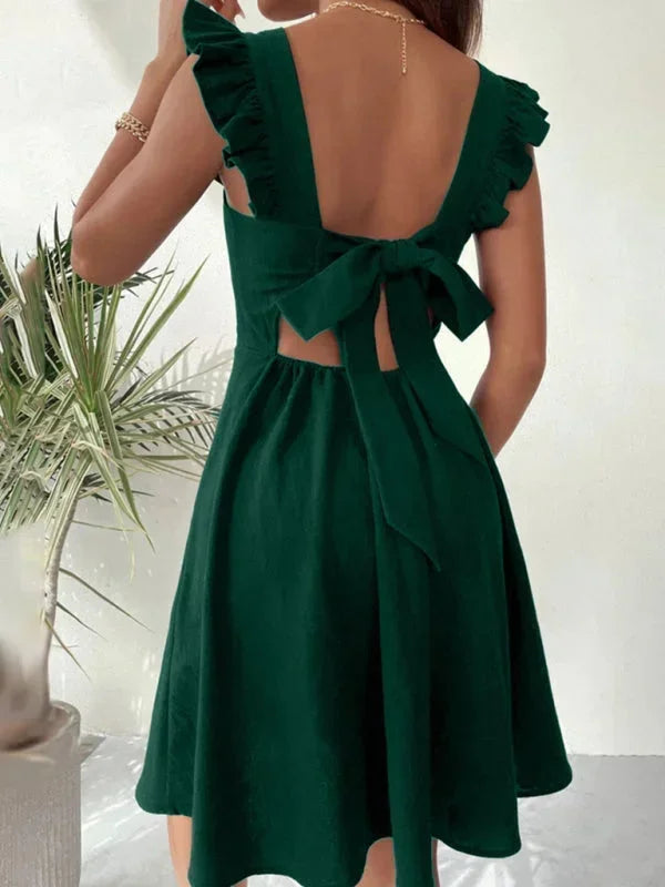Flirty summer dress: Ruffle strap A-line mini with a cute bow back for women.