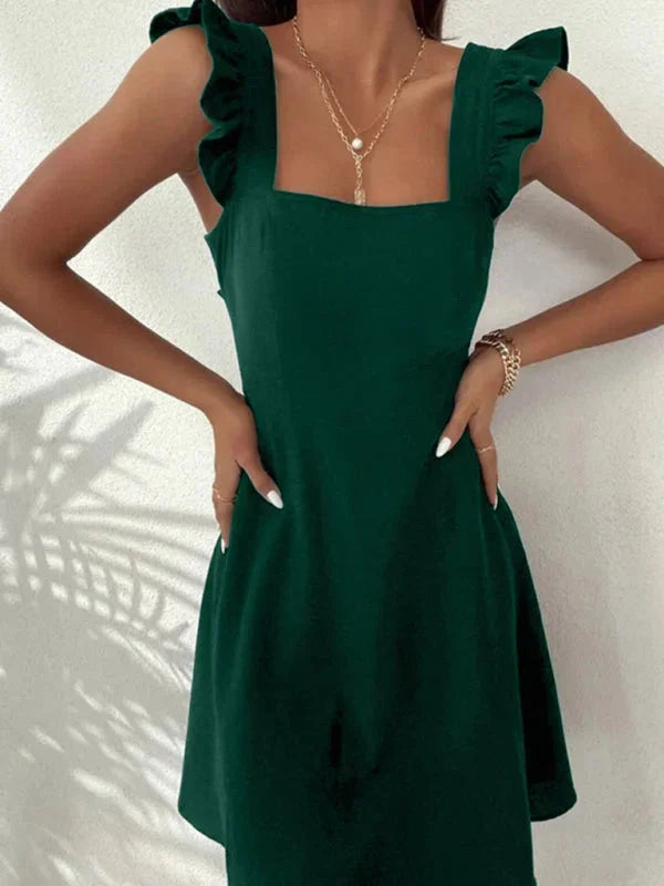 Casual feminine mini dress featuring ruffle straps and a stylish bow back.