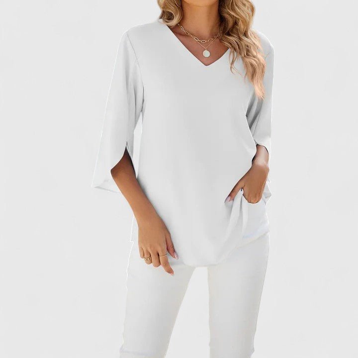 Fashionable women's ruffle V-neck blouse. Split sleeve design adds a chic touch to tops.