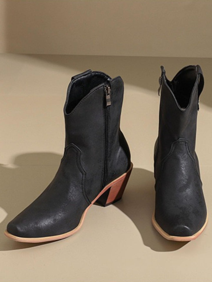 Stylish women's snip toe cowgirl boots, rustic black, wide calf, for a striking western look.