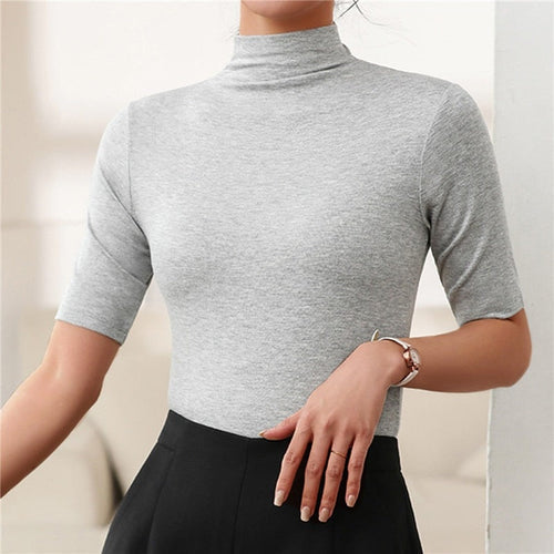 Basic women's slim fit seamless turtleneck top. Essential long sleeve for elegant layering & autumn winter style.