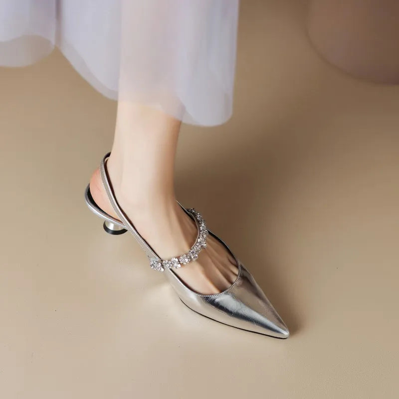 Glamorous crystal slingback pointed toe heels for women, ideal as wedding guest or party shoes.