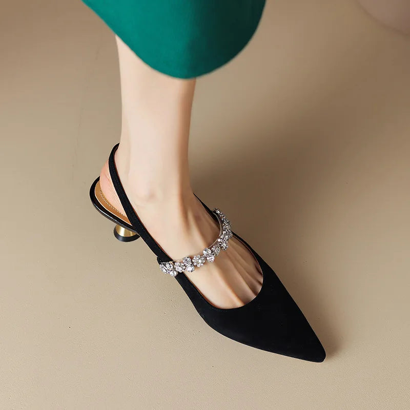Front view of women's elegant pointed toe slingback pumps with glamorous crystal straps.
