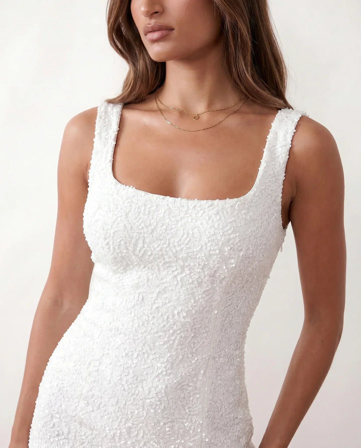 Sparkling square neck sequin mini dress, perfect for a women's cocktail party.