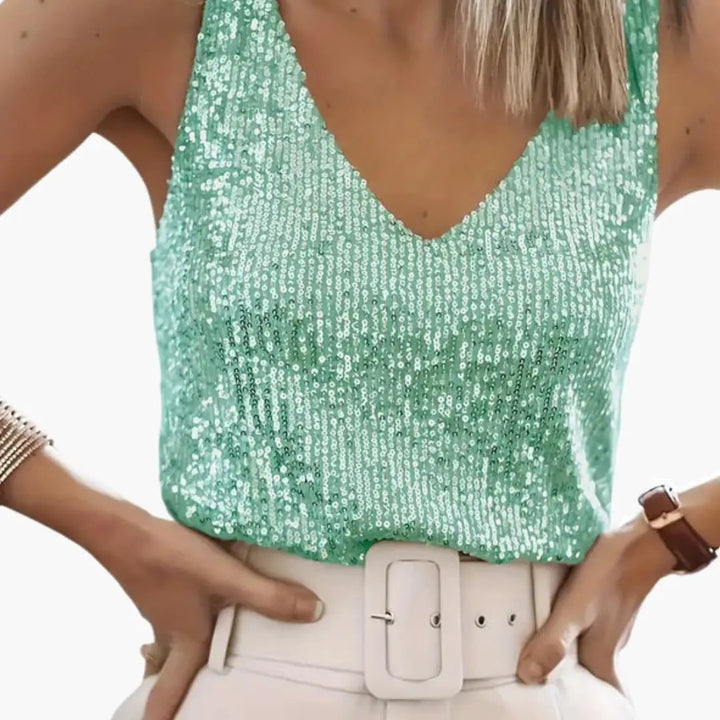 Women's shimmering sequin tank top with round neck for glamorous party wear.