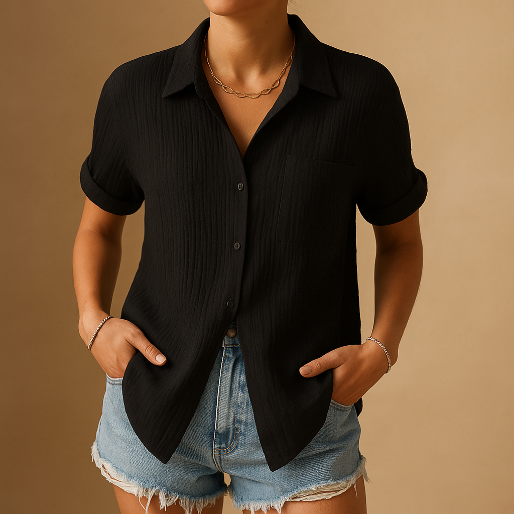 Oversized women's short sleeve shirt, ideal warm weather wear, featuring a practical pocket and relaxed fit.