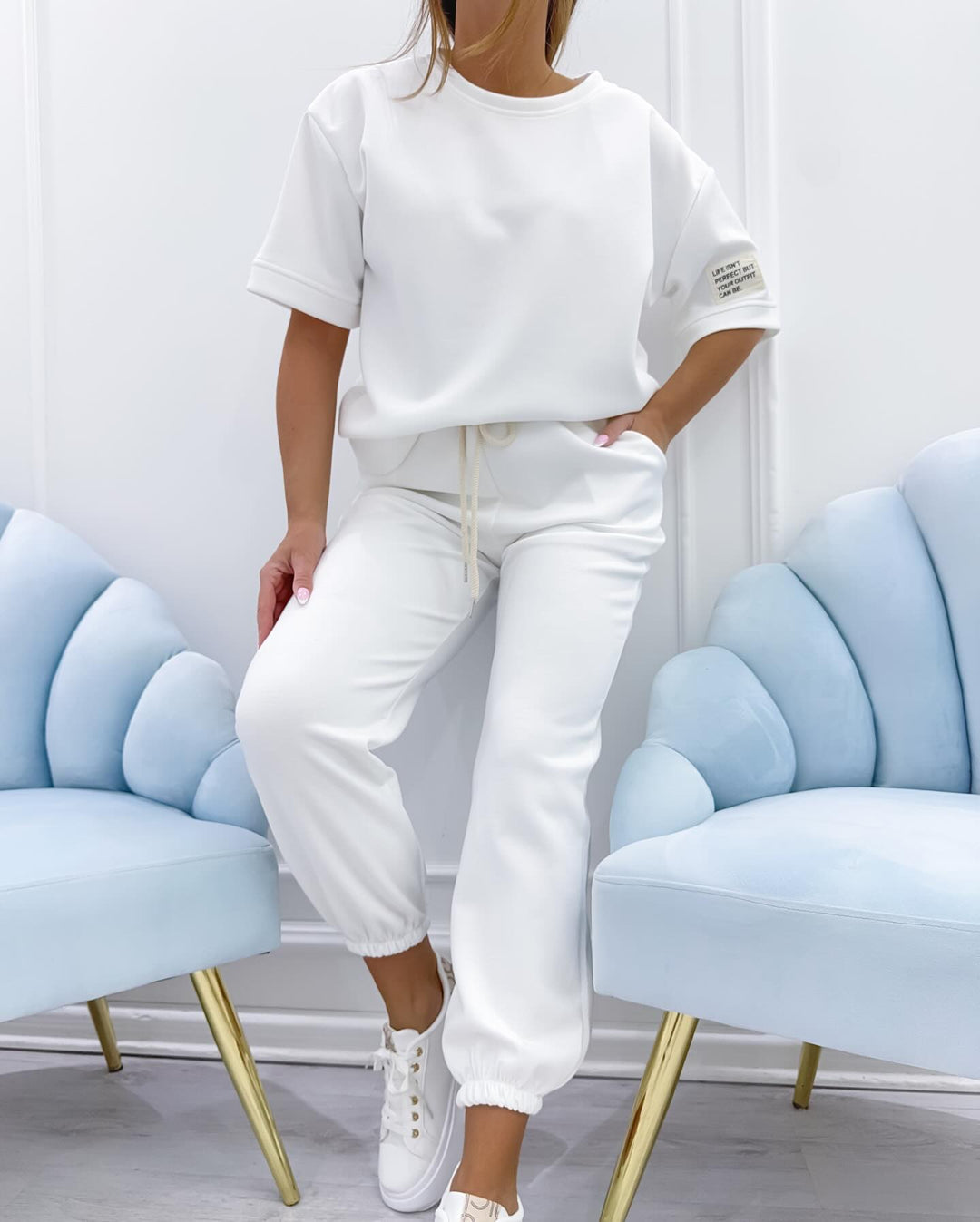 Women's short sleeve lounge set in relaxed fit. Comfortable matching two-piece for casual wear.