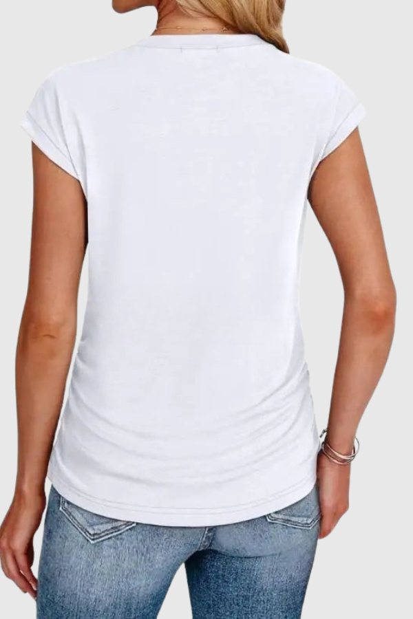 Relaxed fit women's tunic blouse with stylish ruched side detail. Comfortable short sleeve top for summer fashion.