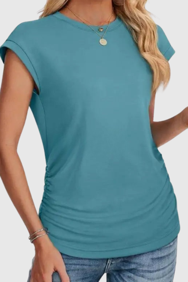 Fashionable women's short sleeve ruched side tunic. This casual blouse offers effortless style and comfortable wear.