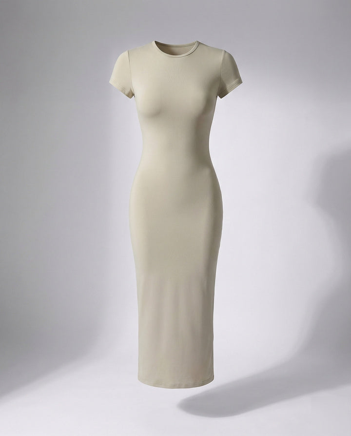 Woman wearing a sleek crew neck short sleeve bodycon maxi dress, showing its elegant fit & versatile style.