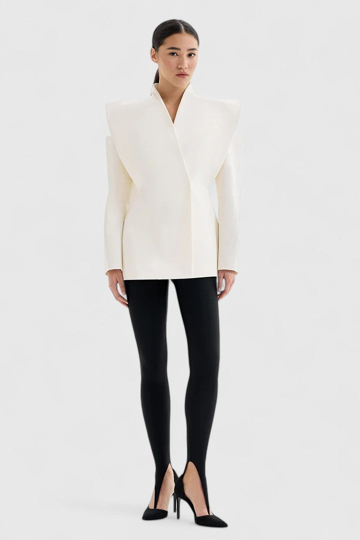 Model wearing a sleek women's ivory structured-shoulder tailored blazer, perfect for modern office and evening wear.