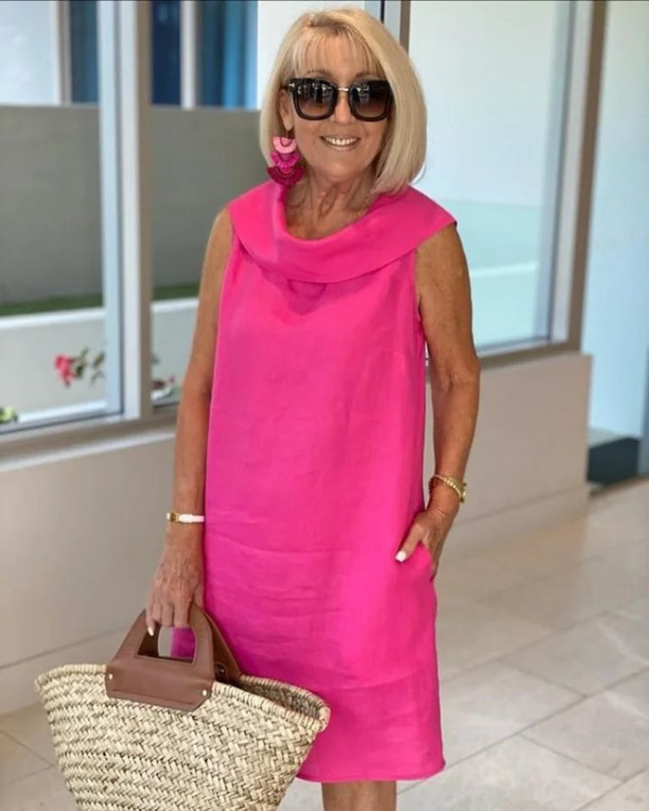 Women's sleeveless cowl neck shift dress with pockets in a relaxed fit, perfect for casual summer wear.