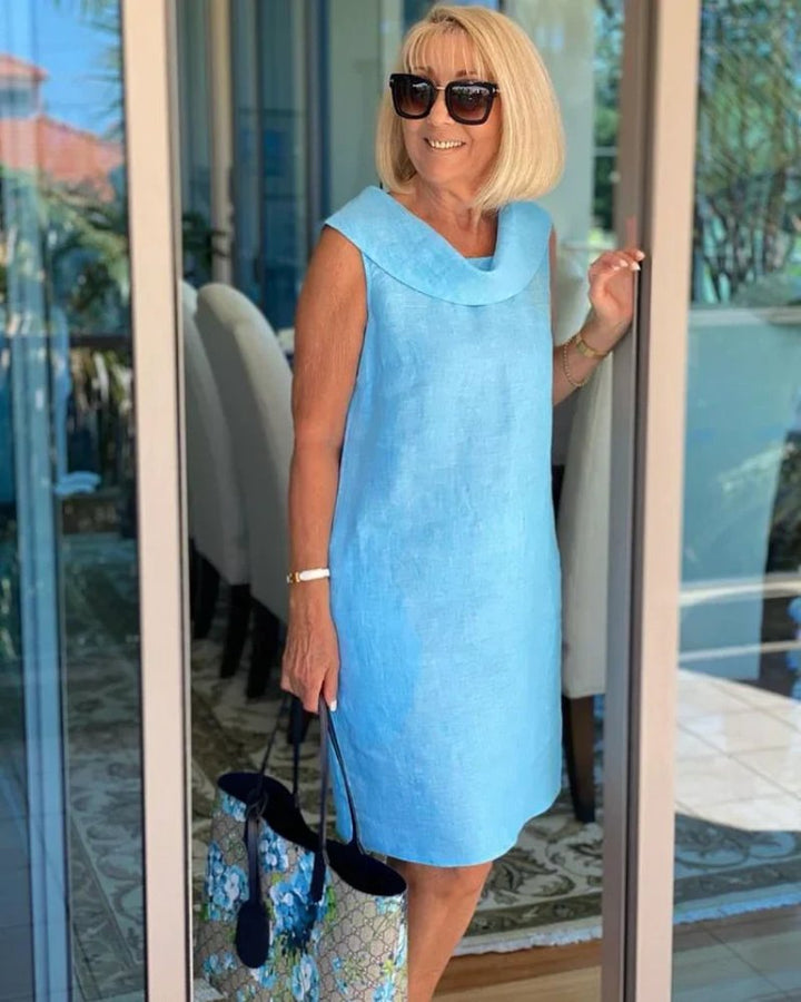 Chic women's cowl neck shift dress, perfect for brunch, vacations, or everyday casual style. Features convenient pockets.