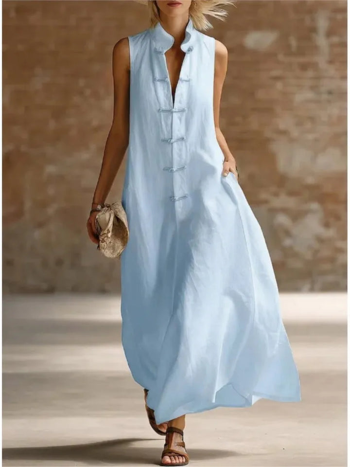 Women's sleeveless maxi shirt dress in white, perfect for effortless summer style & casual wear.