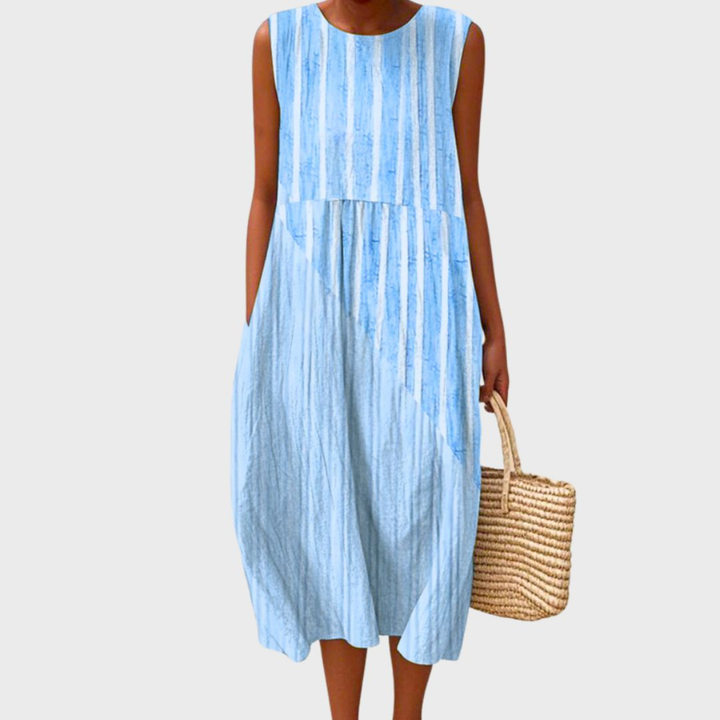Vibrant patchwork print sleeveless midi dress for women, featuring a relaxed bubble hem, ideal for vacation outfits.