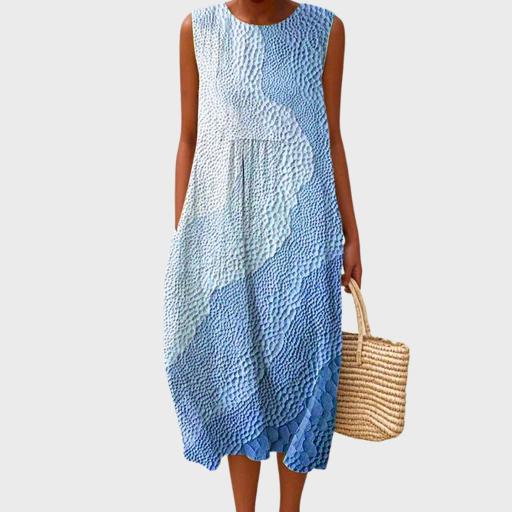 Unique patchwork sleeveless midi dress for women with a comfortable relaxed fit and stylish bubble hem design.
