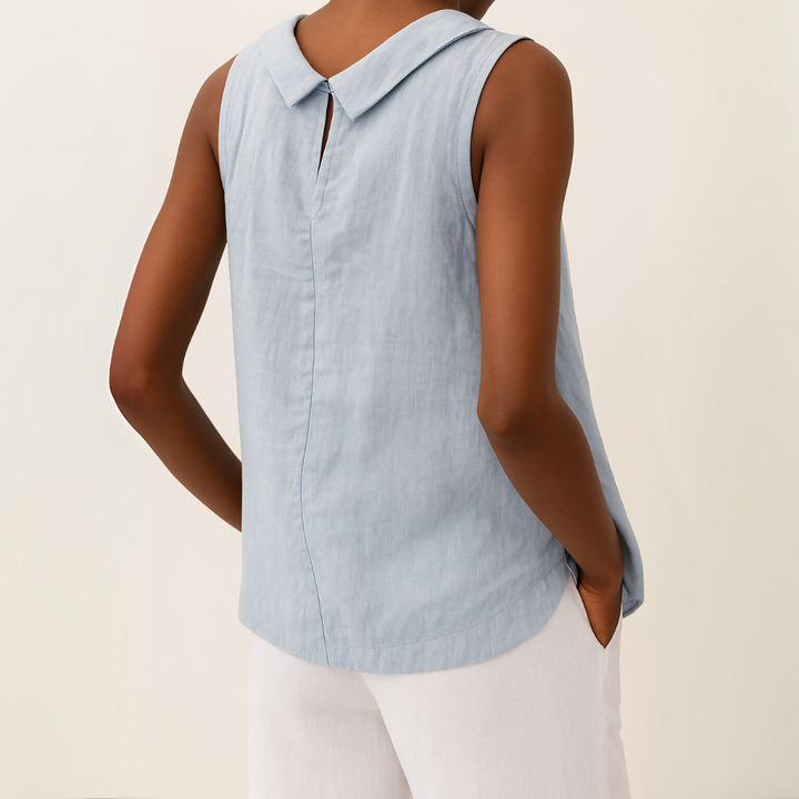 Effortless women's round neck blouse, sleeveless design. Versatile top for office casual or weekend style.