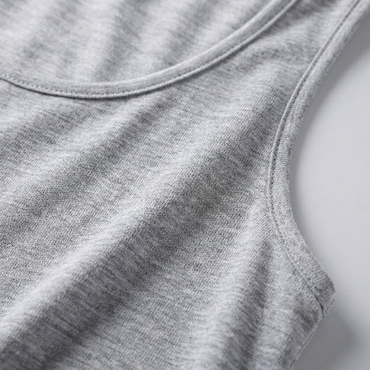 Versatile women's round neck sleeveless top, solid color, ideal for gym workouts or casual activewear.