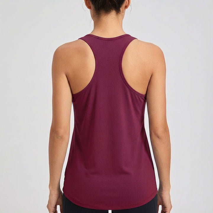 Stylish women's solid sleeveless gym top, round neck, offering comfort and flexibility for any workout.