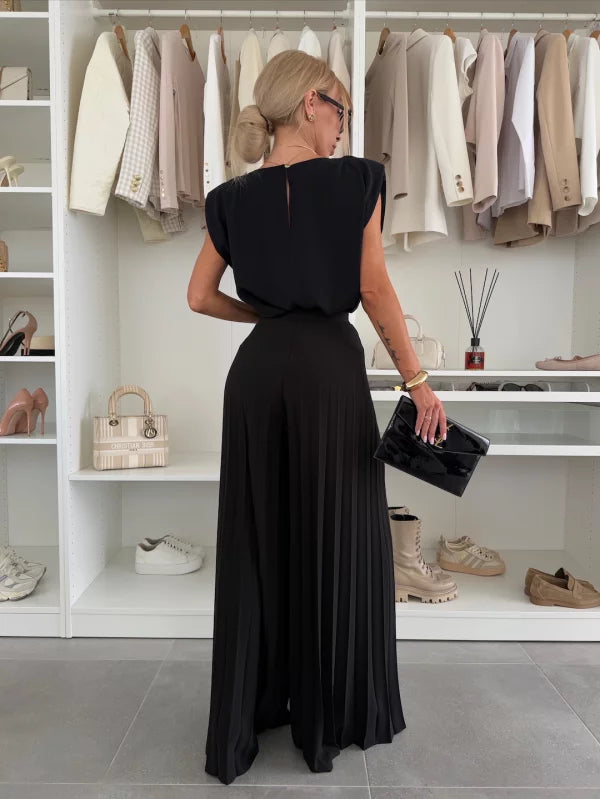 Matching women's sleeveless top and wide leg pants outfit, a chic and comfortable summer fashion choice.
