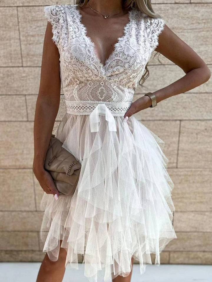 Pink sleeveless V-neck tutu party dress. Stylish women's special occasion mini dress with a full skirt.