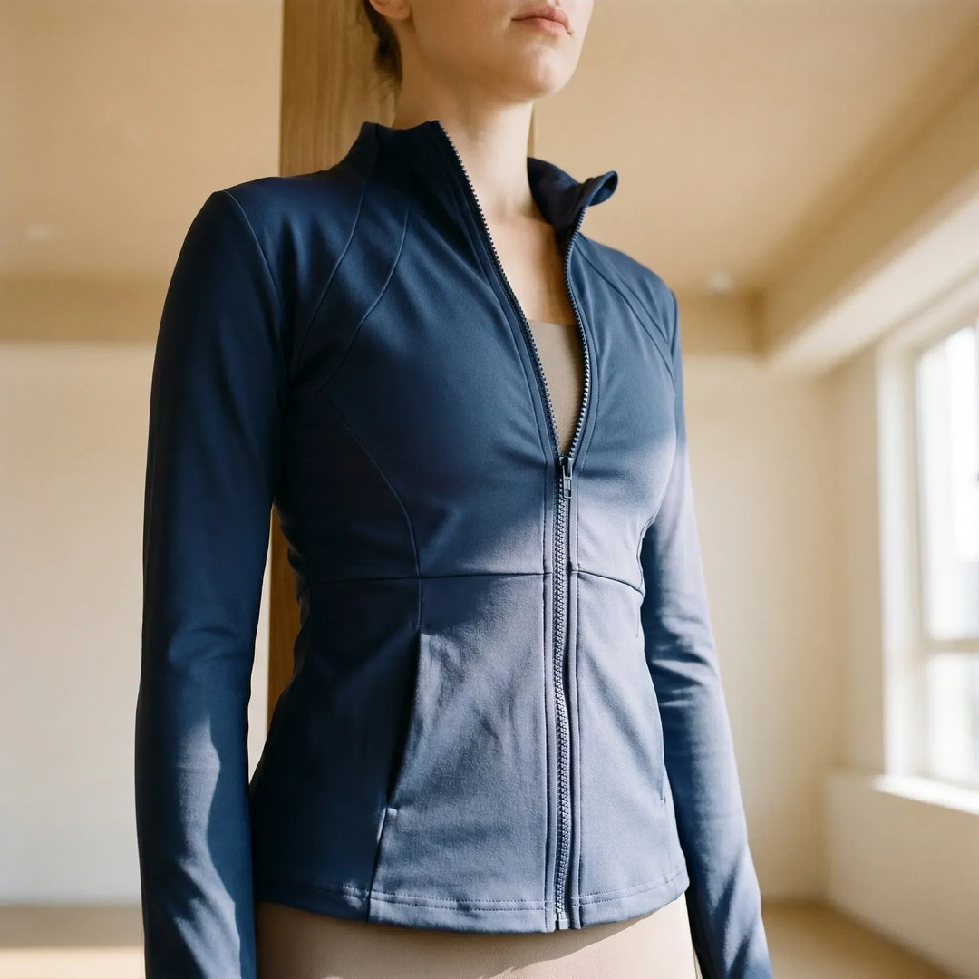 Women's slim-fit activewear jacket, perfect for running & workouts, with thumbholes for comfort.