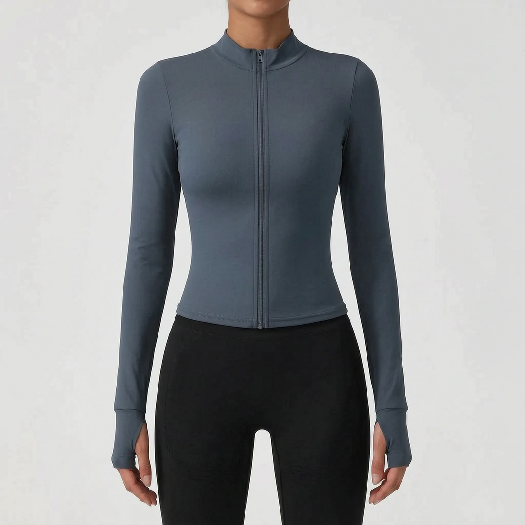 Close-up of women's performance sports jacket zipper & fabric. Durable and sleek activewear.