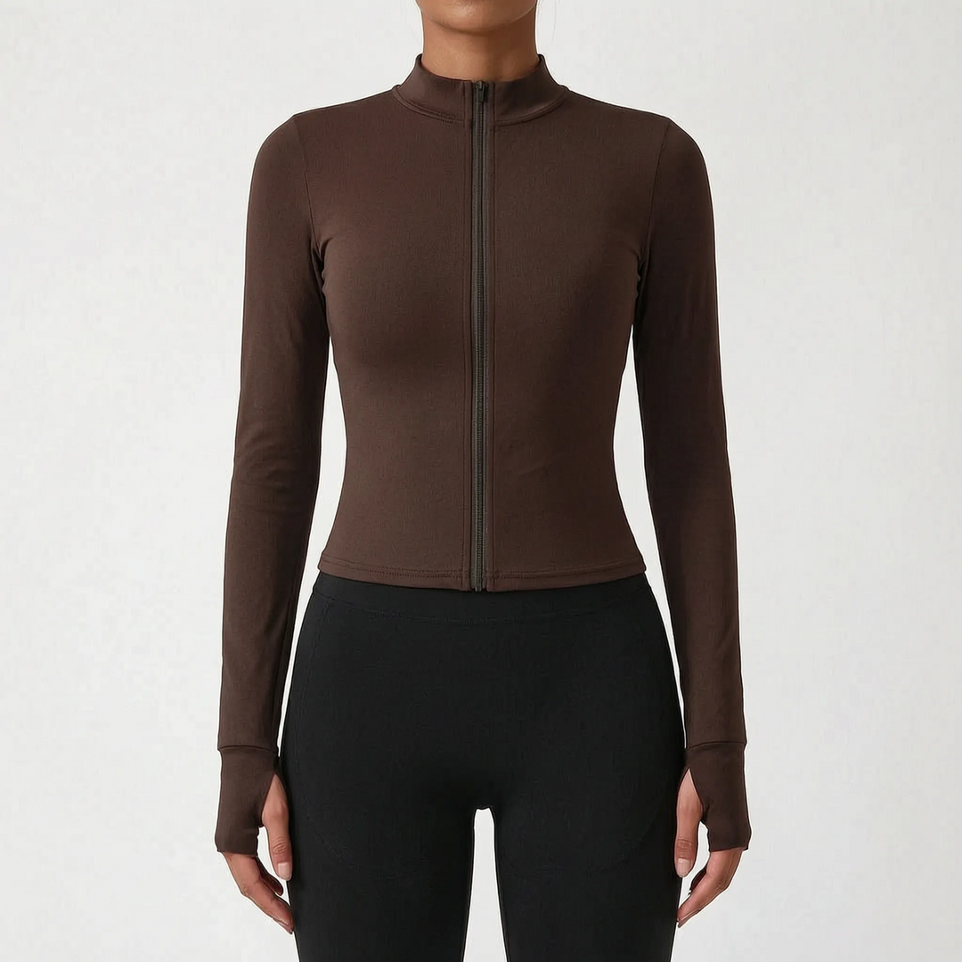Woman exercising in a slim-fit athletic jacket. Versatile for running, gym, or everyday activewear.