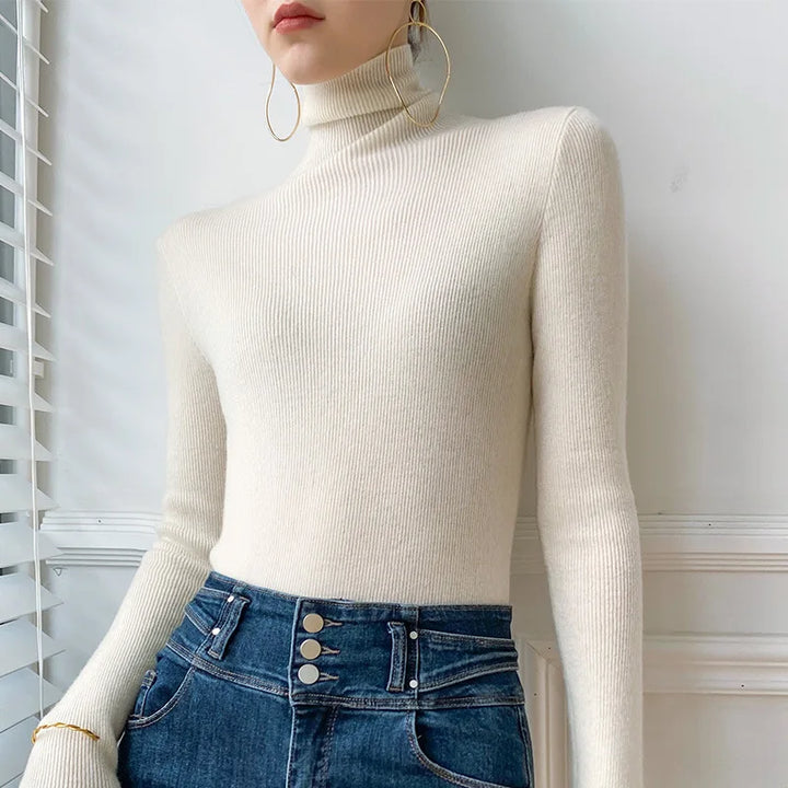 Cozy slim fit women's turtleneck sweater, a versatile long sleeve top for elegant fall and winter layering.