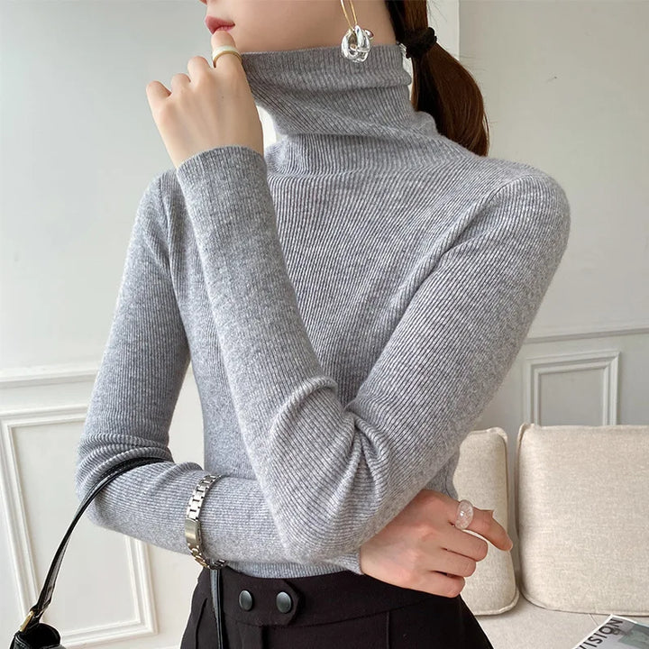 Sophisticated women's knit turtleneck sweater, offering a flattering slim fit for elegant layering. Perfect for winter.