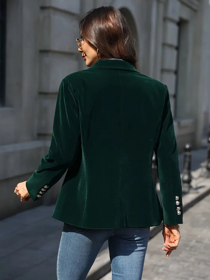 Tailored women's velvet jacket, slim fit, with striking gold button details, very chic.