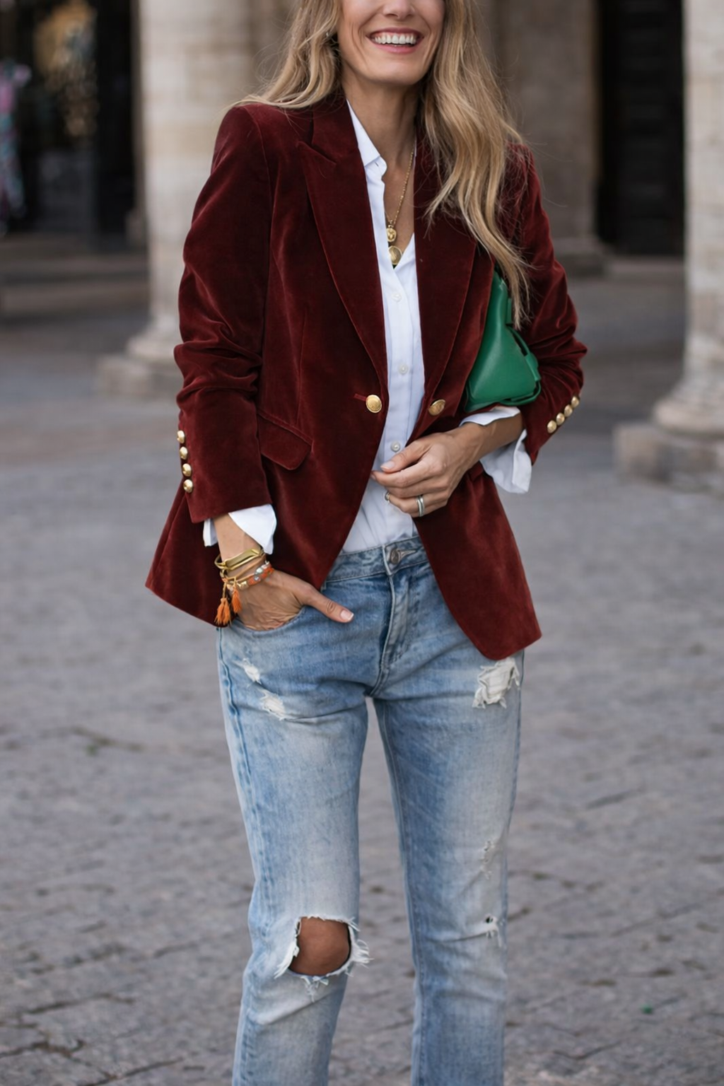 Women's sophisticated velvet tailored jacket with gold buttons, adding a touch of glamour.