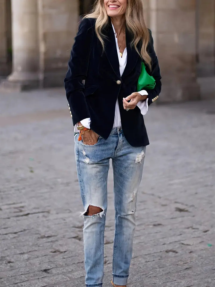 Stylish women's velvet tailored jacket, slim fit, with gleaming gold buttons on front and cuffs.