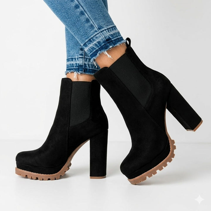 Women's slip-on ankle boots with a stylish platform and sturdy block heel, perfect for casual or evening wear.