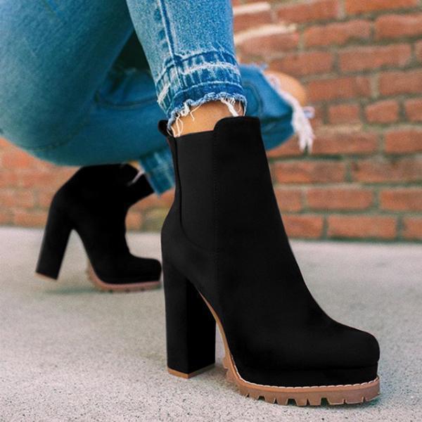 Stylish women's platform ankle boots with a robust block heel and convenient slip-on design for modern fashion.