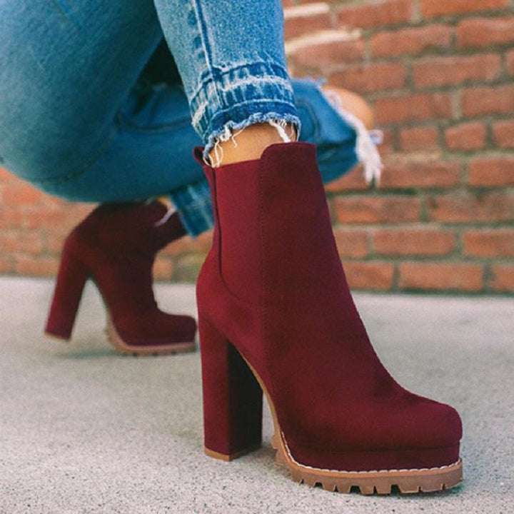 Fashionable women's slip-on boots, ankle height, featuring a trendy platform and comfortable block heel.
