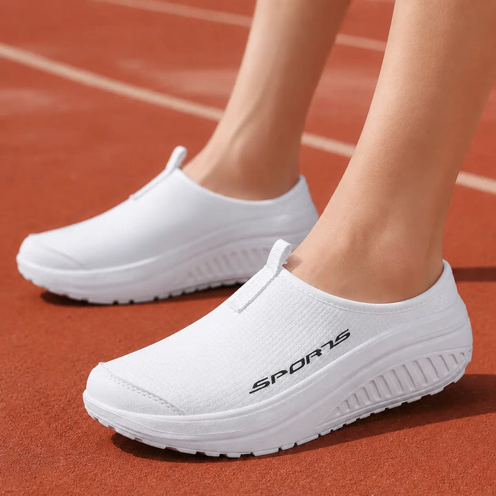 Orthopedic women's slip-on comfort slippers, featuring arch support, soft cushioning for indoor & house use.