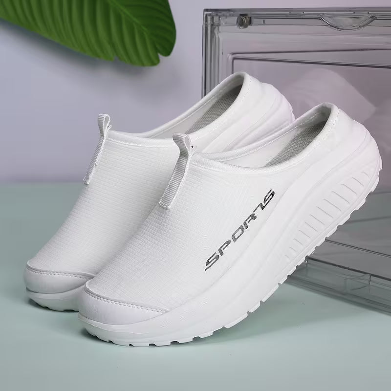 Women's slip-on orthopedic house slippers. Cushioned comfort footwear with arch support for daily indoor wear.