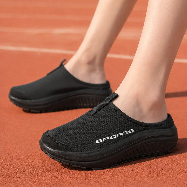 Plush women's slip-on comfort slippers. Orthopedic design with cushioning & arch support for home everyday.