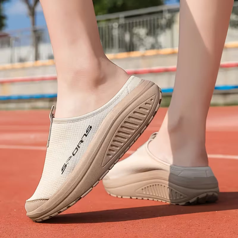 Relaxing women's slip-on house slippers, offering orthopedic arch support & soft cushioning for tired feet.