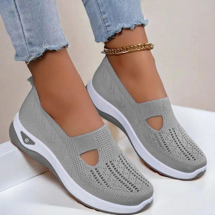 Stylish women's slip-on sneakers, featuring arch support, breathable design for casual summer comfort.