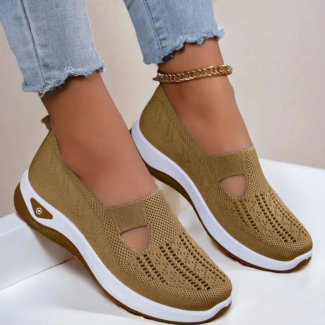 Lightweight women's slip-on sneakers, ideal for summer; features arch support, breathable fabric, and cushioning.